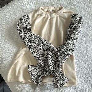 Cream blouse with floral sleeve. Size M.